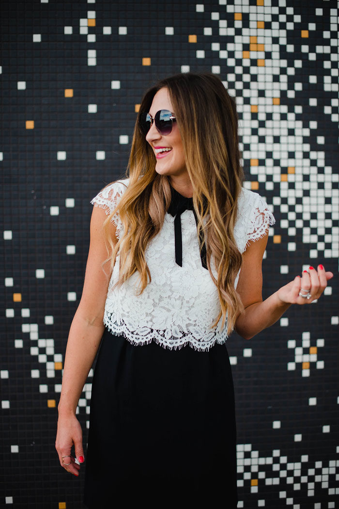 Blogger Mallory Fitzsimmons of Style Your Senses wears a girly black and white lace dress with peter pan collar and bow