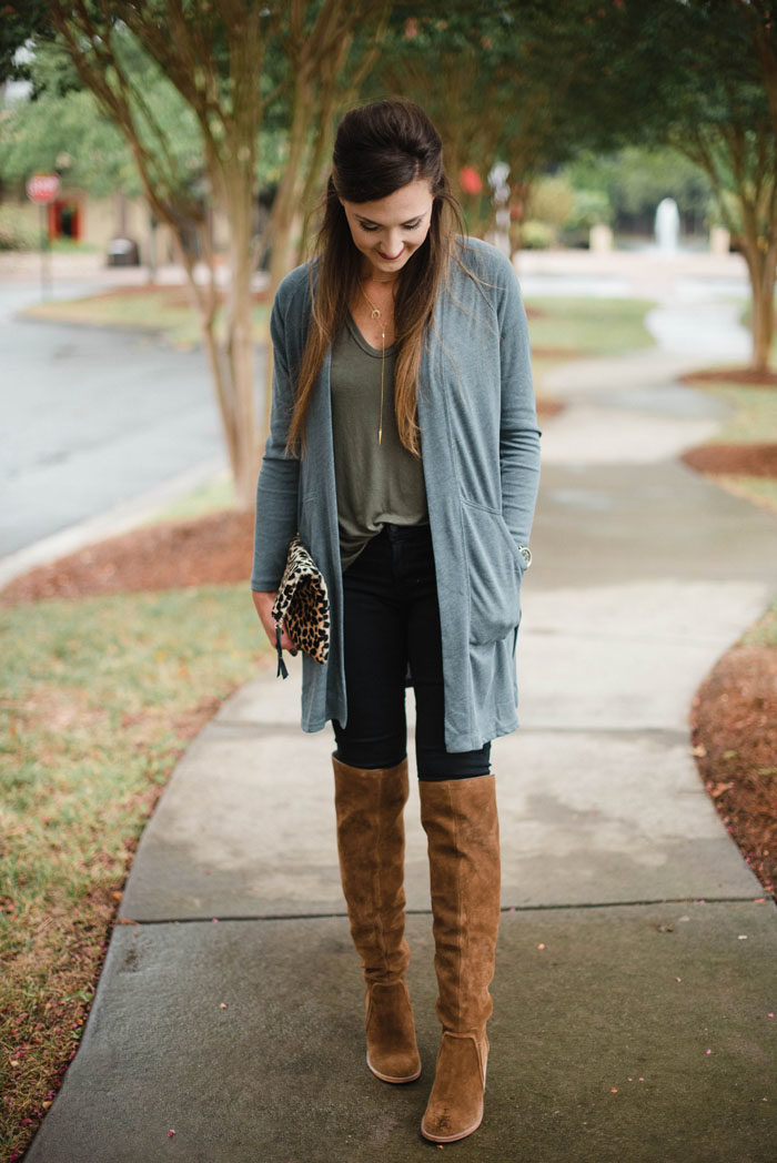 Blogger Mallory Fitzsimmons of Style Your Senses shows how to wear simple layers like a long cardigan and over the knee boots for a casual Fall look.